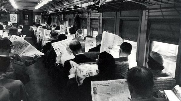 Commuters with their newspapers, the iPhones of yesteryear